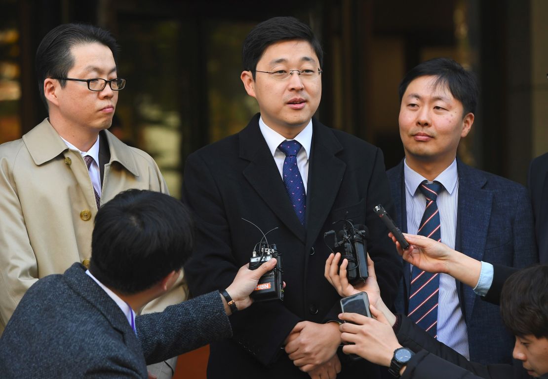 Oh Seung-hun (C), a Jehovah's Witness, speaks to the media after a court's verdict to overturn his conviction on refusing to do mandatory military service, at the supreme court in Seoul on November 1, 2018. 