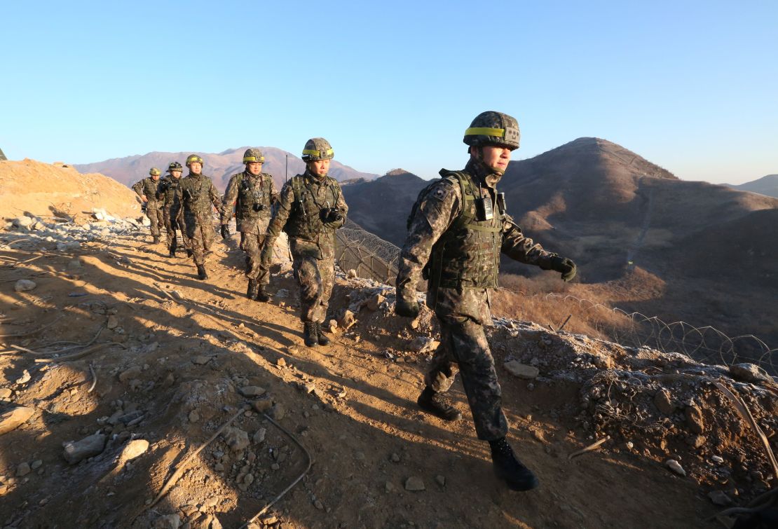 South Korean army soldiers leave for the North to inspect the dismantled North Korean guard post in the central section of the inter-Korean border in Cheorwon, South Korea on December 12, 2018. 