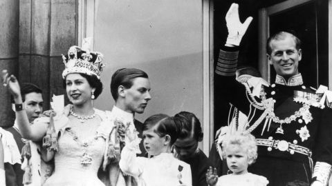Prince Philip waves from the balcony of Buckingham Palace after his wife's coronation in June 1953.