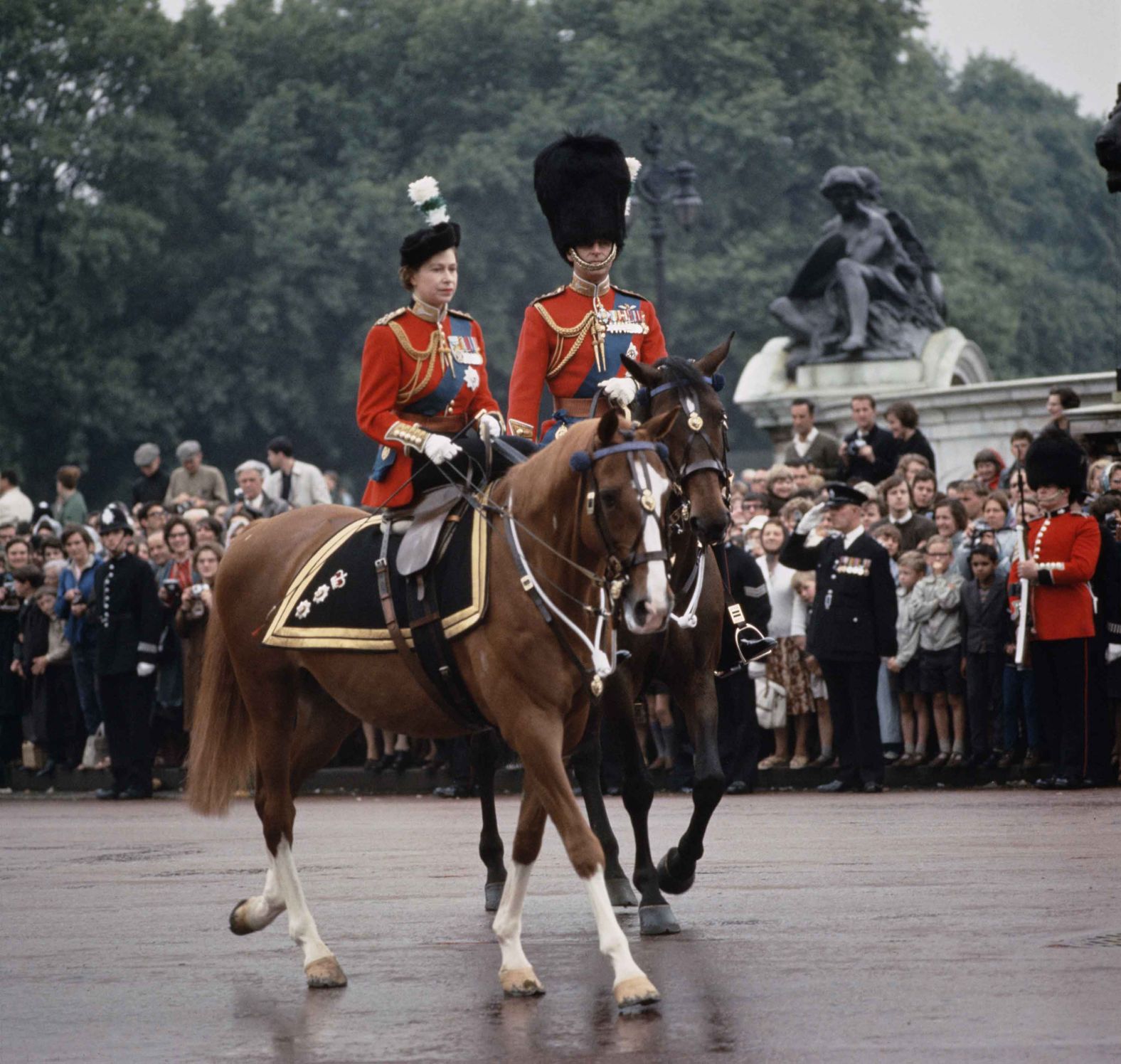 The royal couple return to Buckingham Palace after a ceremony in June 1965.