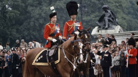 The royal couple return to Buckingham Palace after a ceremony in June 1965.