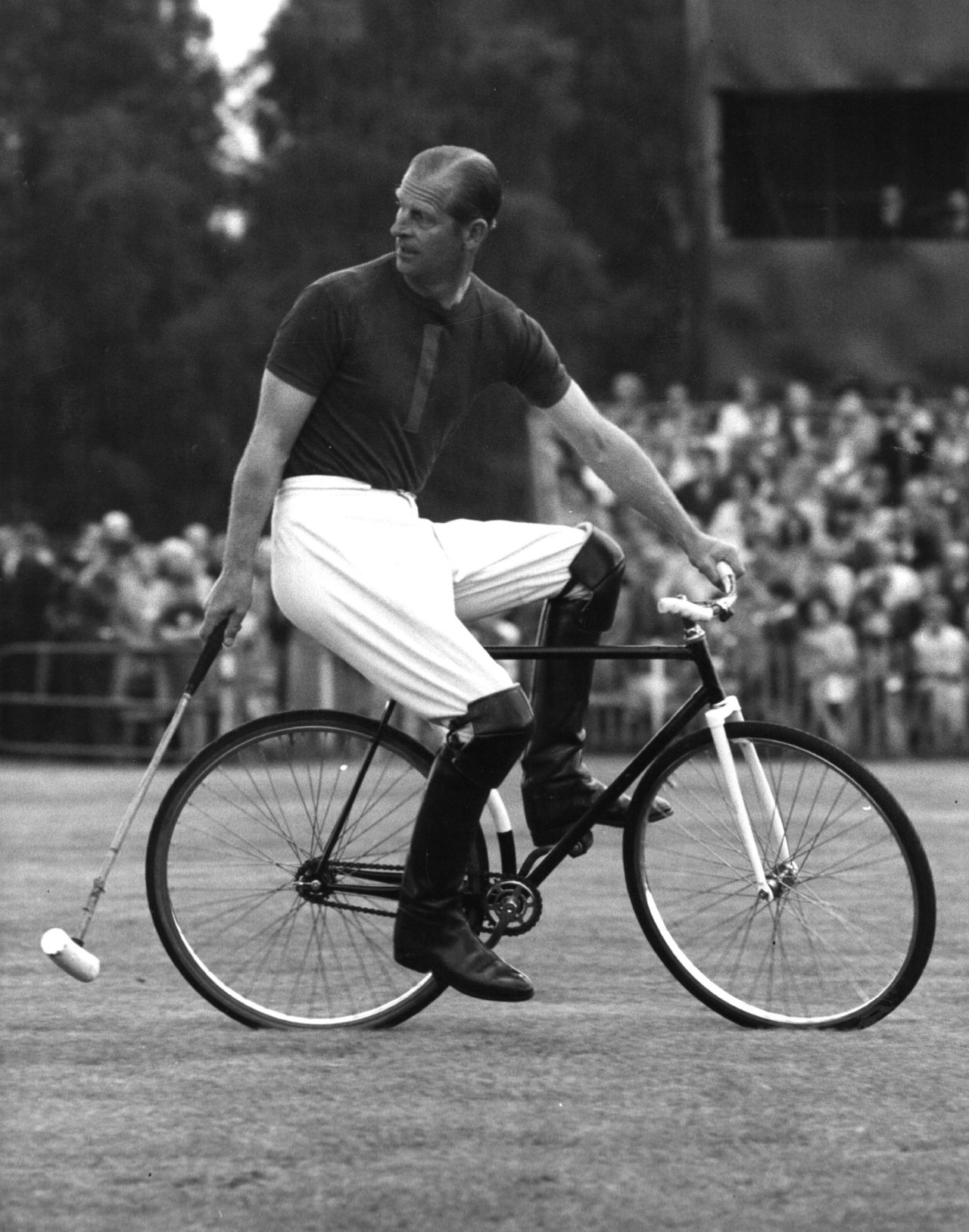 Prince Philip competes in a bicycle polo match in August 1967.