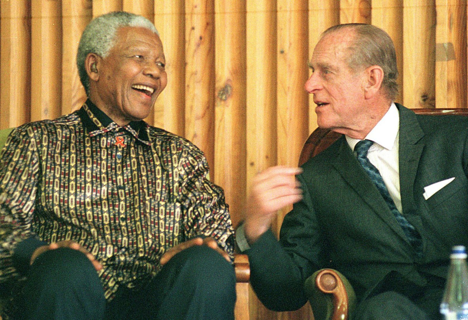Former South African President Nelson Mandela chats with Prince Philip in November 2000.