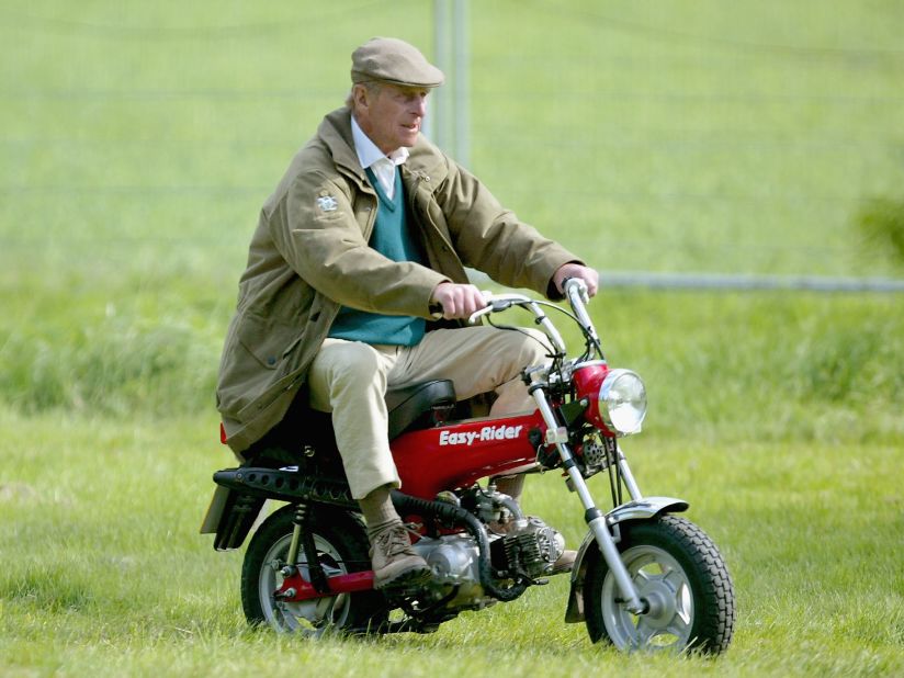 Prince Philip rides a mini motorbike at the Royal Windsor Horse Show in May 2005.