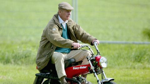 Prince Philip rides a mini motorbike at the Royal Windsor Horse Show in May 2005.