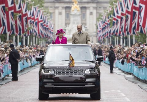 The Queen and Prince Philip wave to guests in June 2016, during celebrations for her 90th birthday.