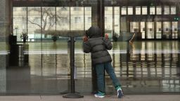 WASHINGTON, DC - JANUARY 02:  Christain Saint-Surin, 7 years-old, of Miami, Florida looks inside the National Museum of African American History that is closed due to the partial shutdown of the U.S. government as it goes into the 12th day, on January 2, 2019 in Washington, DC. With the new congress scheduled to start on January 3, Congressional Democrats and Republicans have not come to a bipartisan solution to President Donald Trump's demands for more money to build a wall along the U.S.-Mexico border.  (Photo by Mark Wilson/Getty Images)
