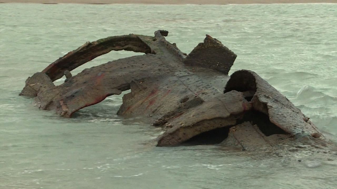 The metal frame of the German U-boat UC 61 is visible during low tide in Wissant, France.