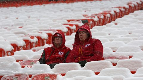 Fans sit in the cold and snow before the Kansas City Chiefs face the Indianapolis Colts on Saturday at Arrowhead Stadium.