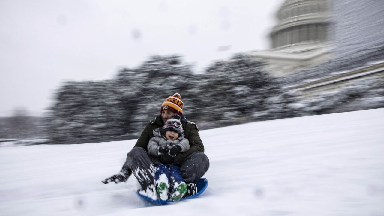 The US Capitol provides the setting for some sledding fun.