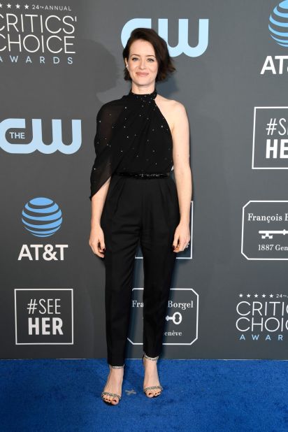 Claire Foy attends the 24th annual Critics' Choice Awards in a semi-sheer one-shoulder top and trousers. 