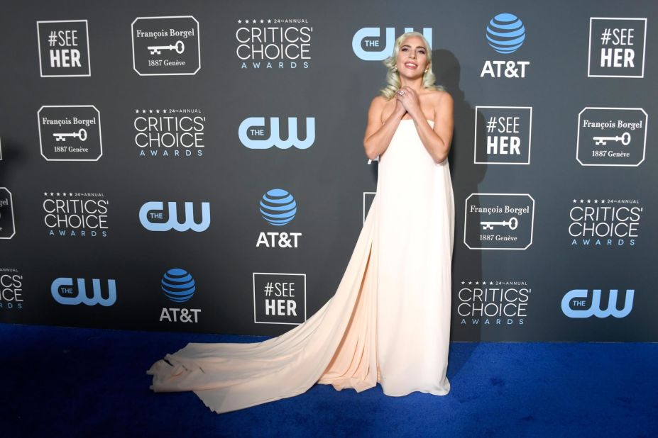 Lady Gaga wore a strapless pale peach Calvin Klein gown with a short train.
