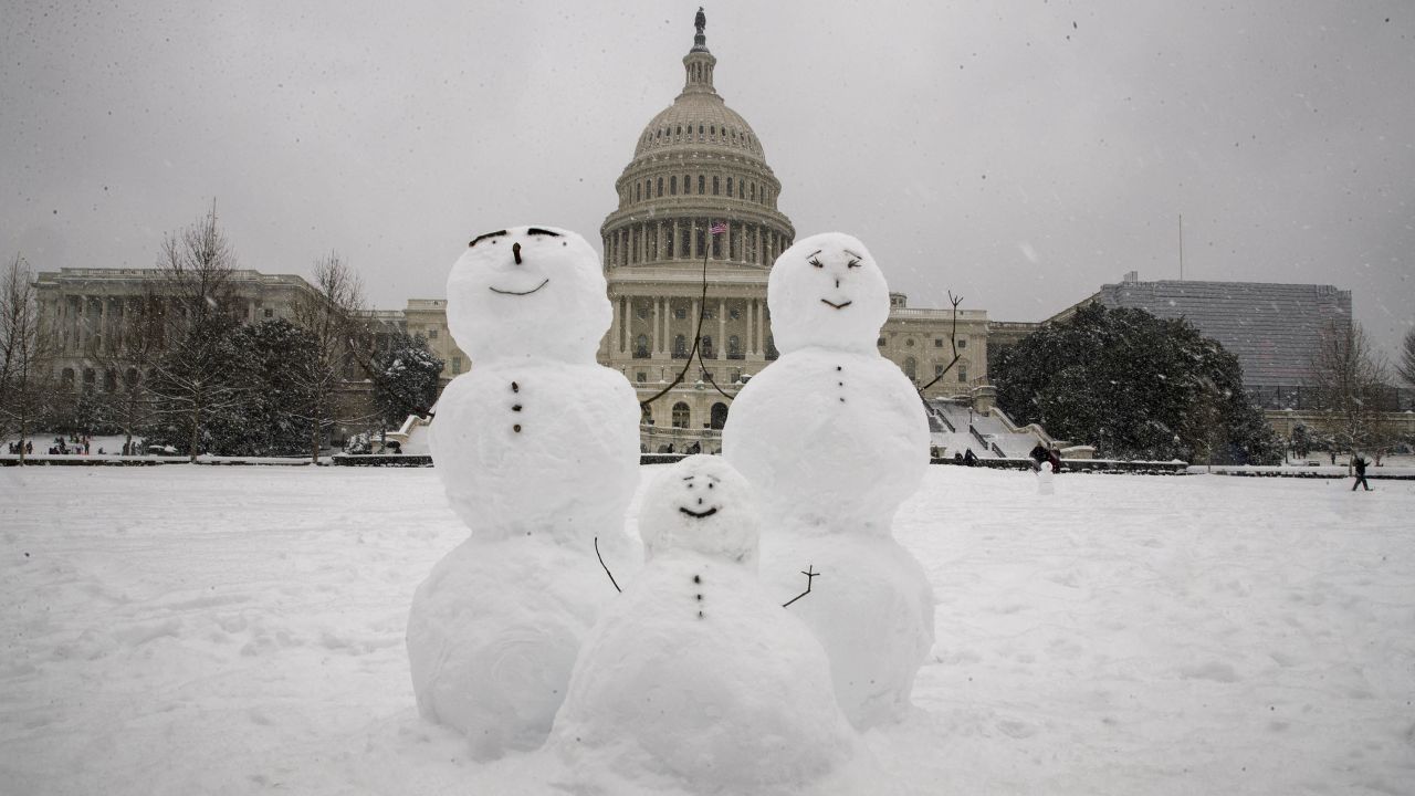 A snow family is seen on Capitol Hill as a winter storm arrives in the region on  Sunday, January 13, 2019.