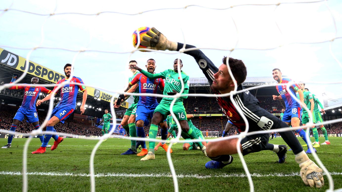 Ben Foster of Watford attempts to clear the ball as Crystal Palace scores its first goal during a Premier League match between Crystal Palace and Watford FC in London on January 12.