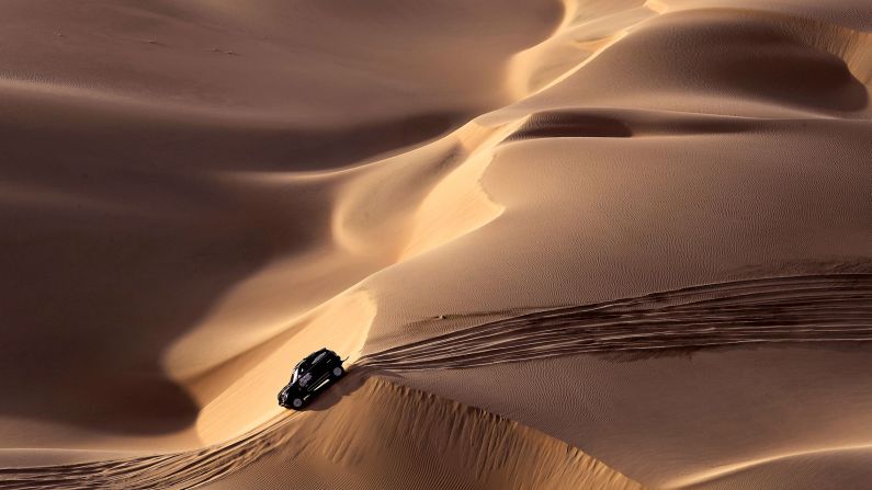 Mini's Spanish driver Nani Roma and co-driver Alexandre Haro Bravo navigate sand and dunes on stage nine.