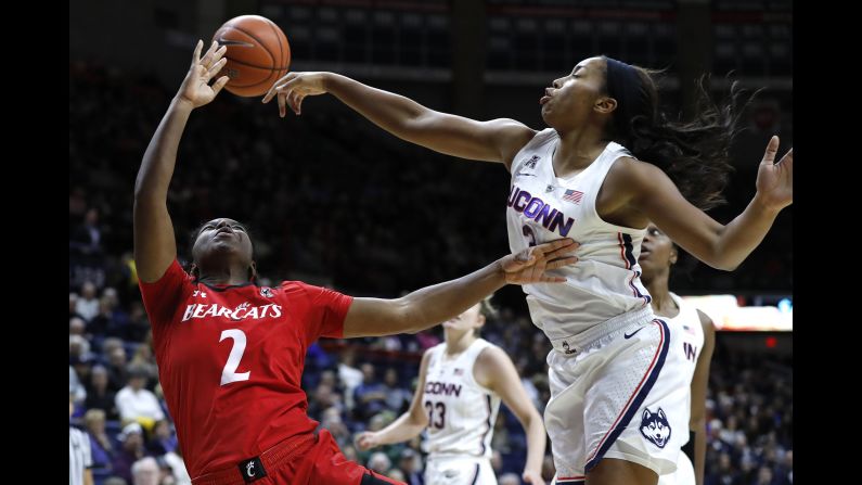 Connecticut Huskies guard/forward Megan Walker blocks a shot by Cincinnati Bearcats guard Nikira Goings in the second half at Gampel Pavilion in Mansfield, Connecticut, on January 9.