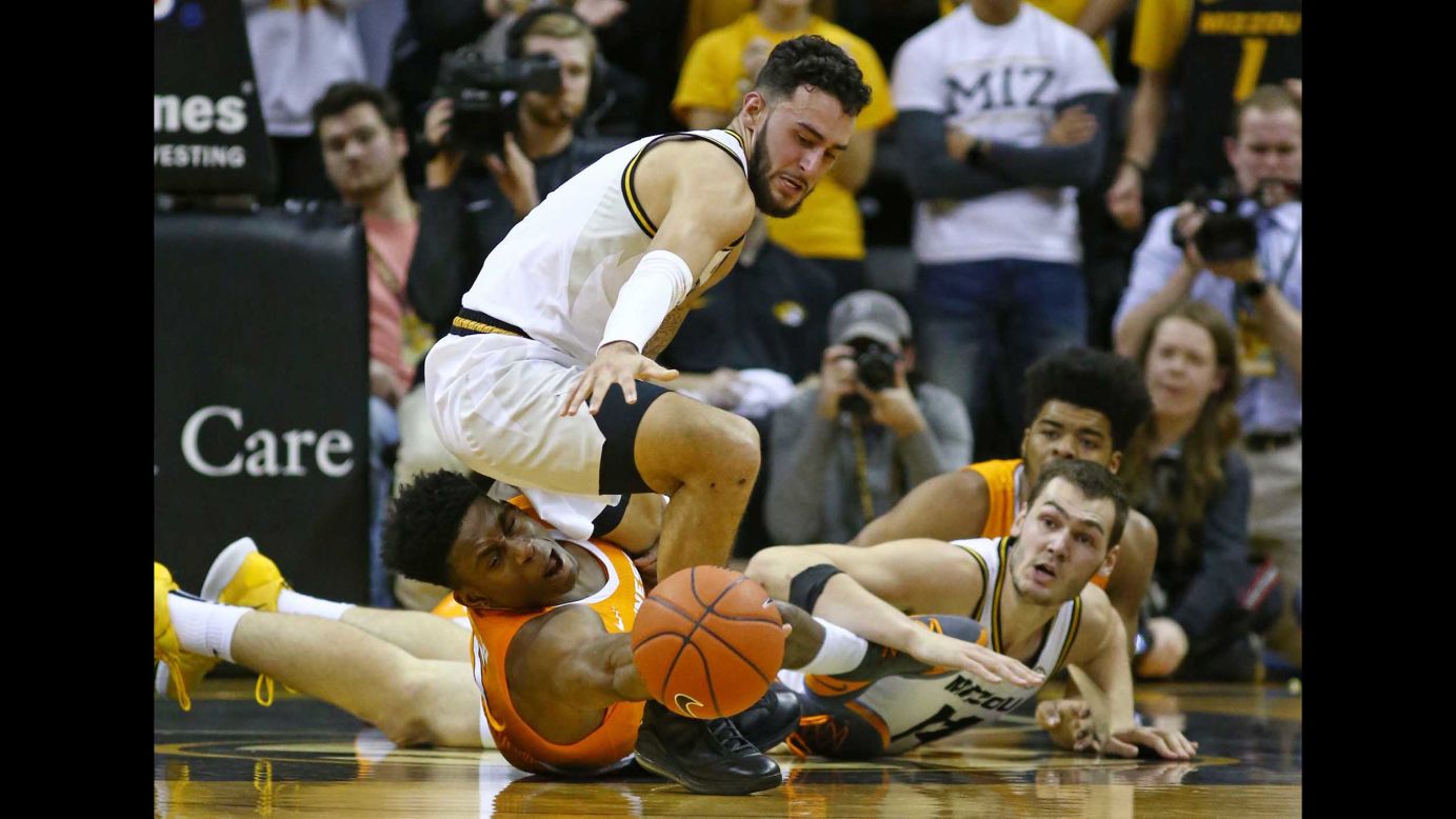 Missouri Tigers guard Jordan Geist and forward Reed Nikko go after a loose ball against Tennessee Volunteers guard Admiral Schofield and forward Derrick Walker in the first half at Mizzou Arena in Columbia, Missouri, on January 8.