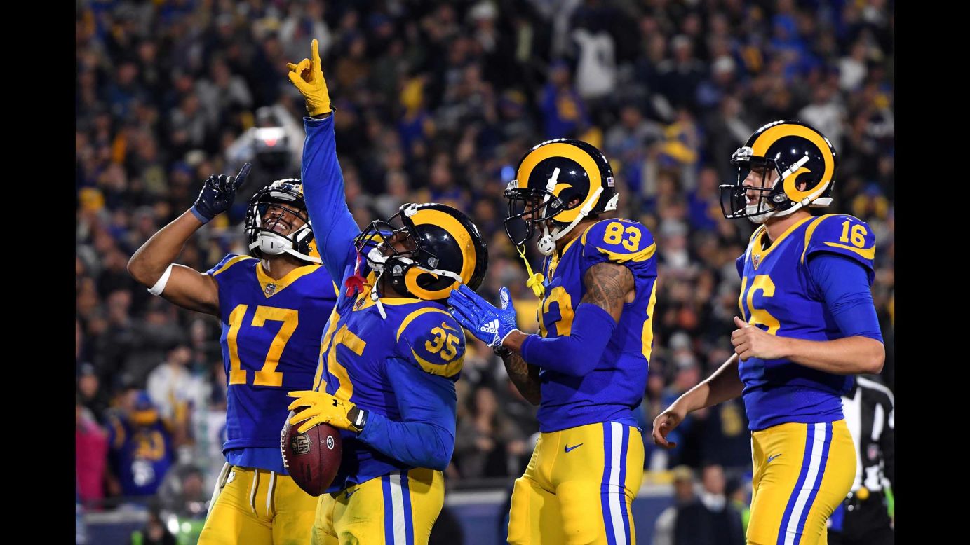 C.J. Anderson of the Los Angeles Rams celebrates with teammates after scoring a 1-yard touchdown in the second quarter against the Dallas Cowboys in the NFC Divisional Playoff game at Los Angeles Memorial Coliseum on January 12.