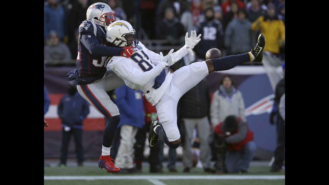 New England Patriots defensive back Devin McCourty, left, breaks up a pass intended for Los Angeles Chargers wide receiver Mike Williams during the first half of an NFL divisional playoff football game  in Foxborough, Massachusetts, on January 13.