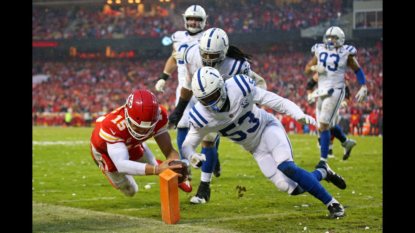 Kansas City Chiefs quarterback Patrick Mahomes scores a touchdown  against Indianapolis Colts outside linebacker Darius Leonard during the second quarter in an AFC Divisional playoff football game at Arrowhead Stadium in Kansas City, Missouri, on January 12.