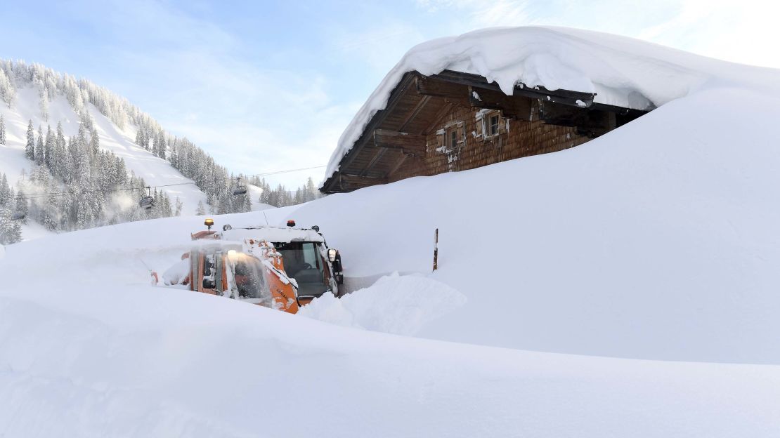 A snow blower attempts to clear a path in Lofer, Austria.