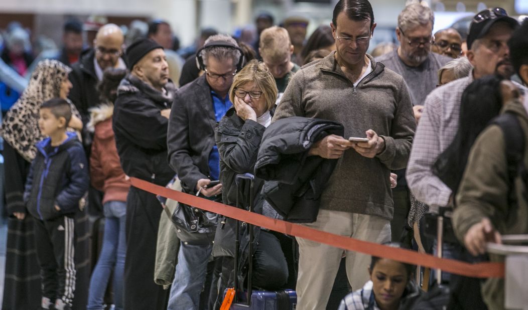 Security lines at Atlanta's Hartsfield-Jackson International Airport back up Monday, January 14, causing some travelers to miss their flights. Officers with the Transportation Security Administration had been working without pay.