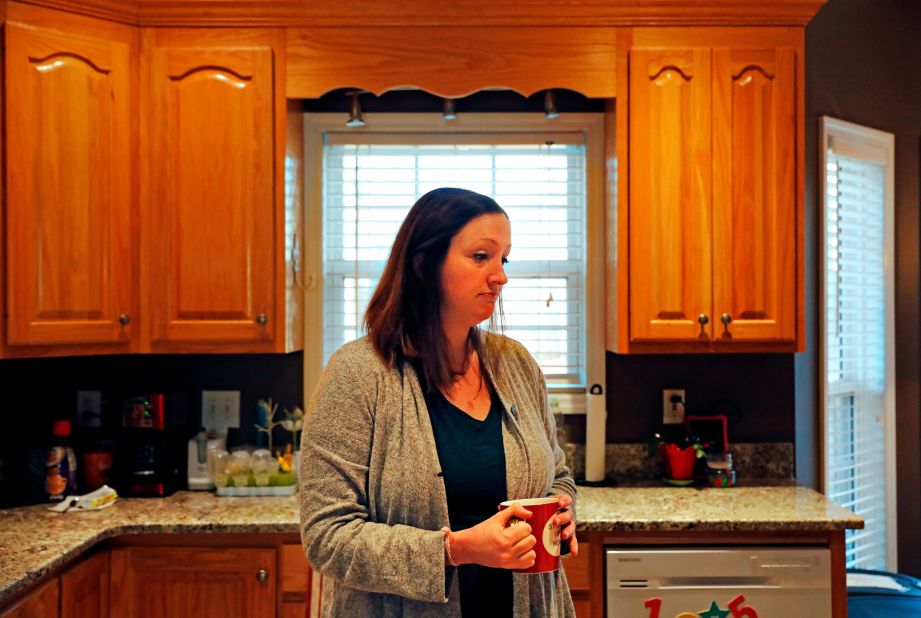Katie Barron stands in her kitchen while working from home in Madison, Alabama, on Wednesday, January 9. Barron works for a private company not connected to the government, but her husband is a National Weather Service meteorologist who was forced to work without pay because his job is classified as essential.