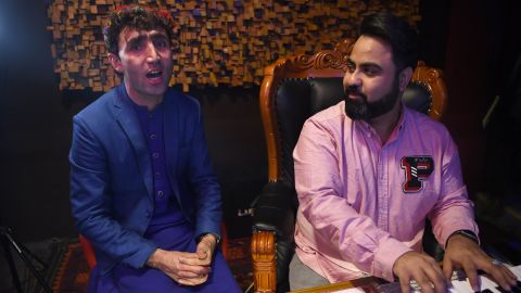 Maftoon rehearses next to a judge from the 'Afghan Star' show.