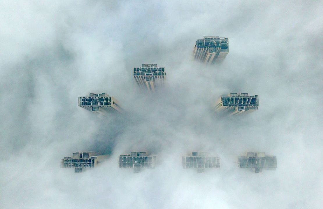 This aerial view shows the tops of highrise buildings poking out from heavy fog in Yangzhou, in China's eastern Jiangsu province on January 14, 2019. 