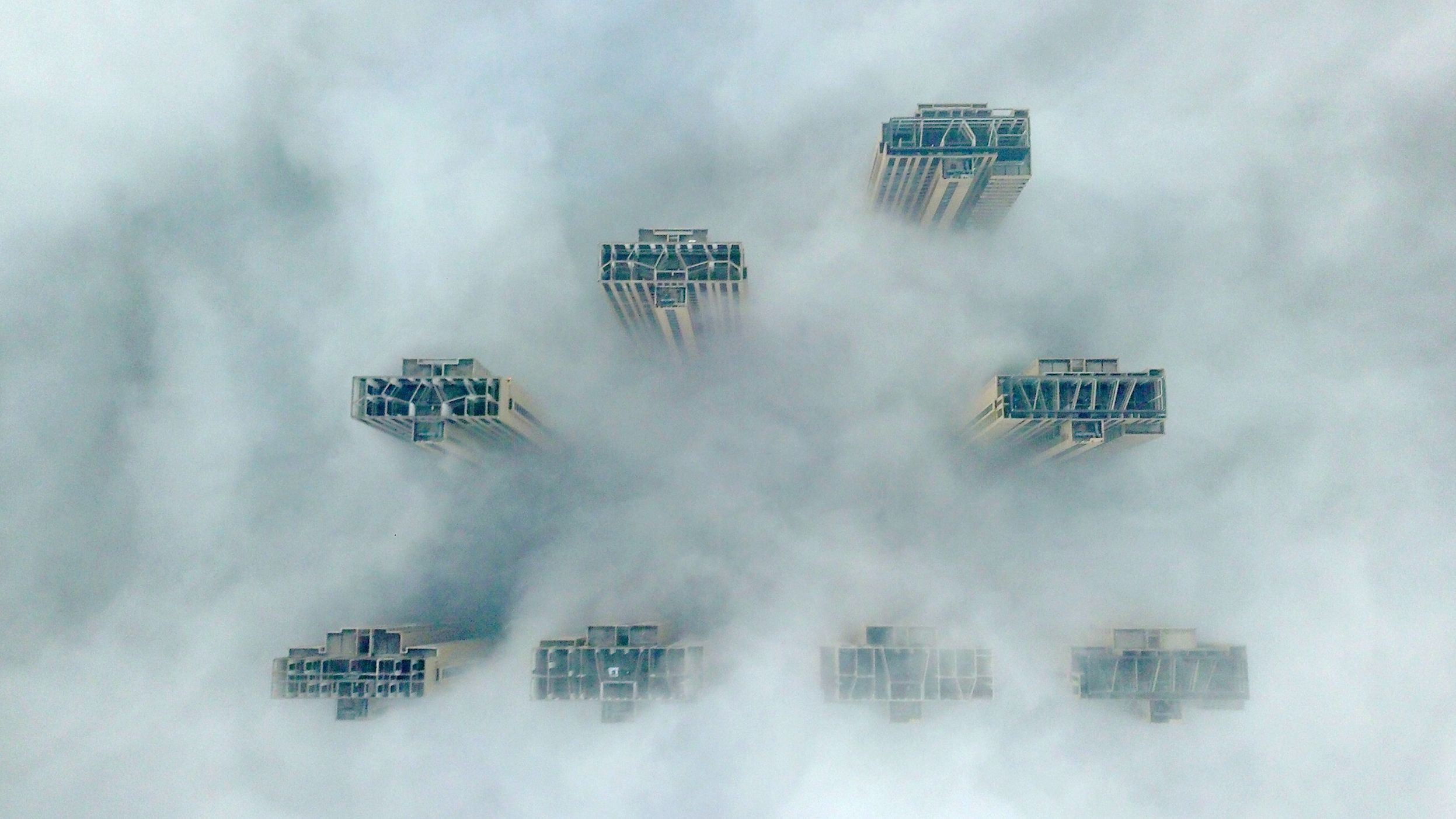 This aerial view shows the tops of highrise buildings poking out from heavy fog in Yangzhou, in China's eastern Jiangsu province on January 14, 2019. 