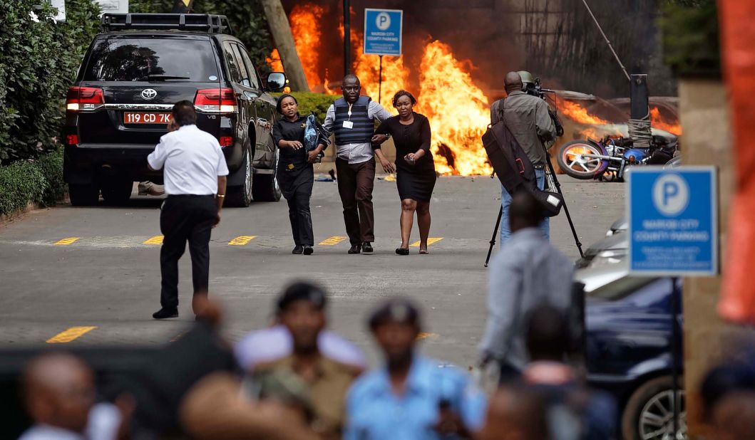 Security forces help people flee the scene of the attack in Nairobi on January 15.