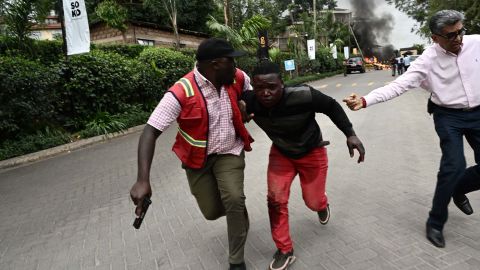 An injured man is evacuated from the scene of an explosion at a hotel complex in Nairobi's Westlands suburb on January 15, 2019, in Kenya. - A gunfight was underway following the blast in the leafy Nairobi neighbourhood, an AFP reporter and a witness said. It was not immediately clear whether the incident was a robbery or an attack. (Photo by SIMON MAINA / AFP) (Photo credit should read SIMON MAINA/AFP/Getty Images)