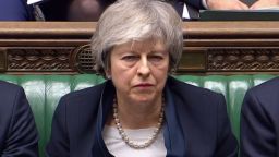 Theresa May listens to opposition leader Jeremy Corbyn in the Brexit debate