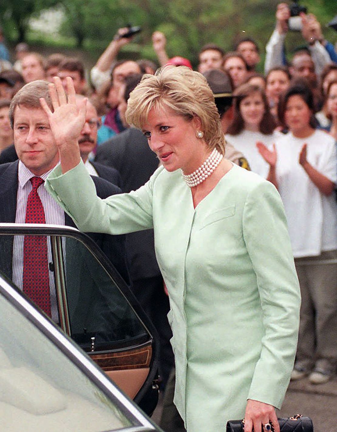 Princess Diana waves to cheering crowds as she visits Northwestern University in Chicago in June 1996.