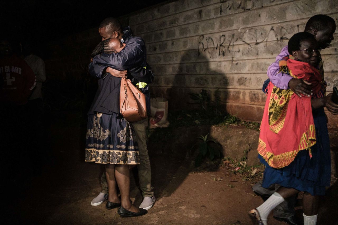 People hug after their evacuation from the DusitD2 compound on Tuesday, January 15.