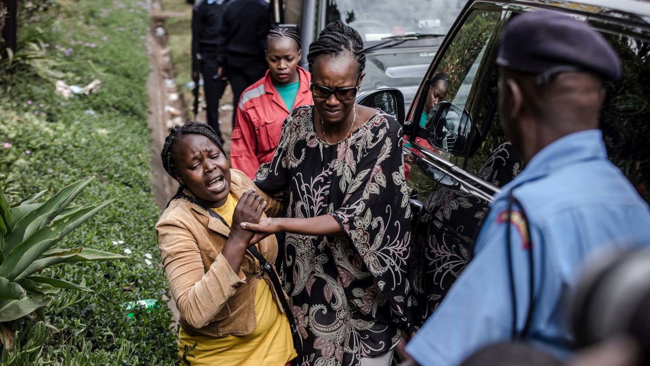 A woman is rescued Wednesday from the scene of the attack at a hotel complex.