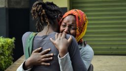 A woman cries in the arms of a relative in Nairobi, on January 16, 2019, while identifying the bodies of the victims after a blast followed by a gun battle at an upmarket hotel complex.