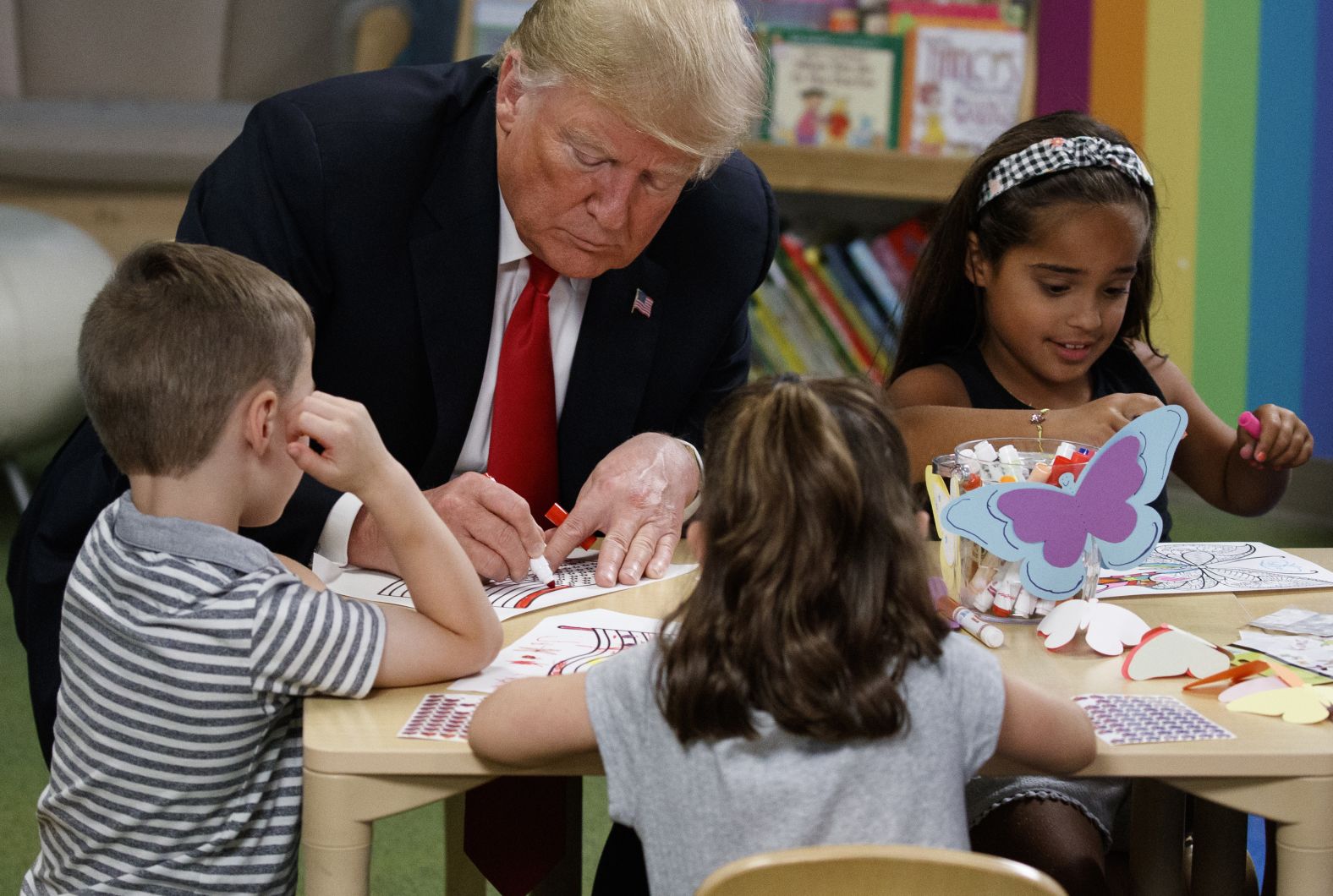 Trump colors with a group of children during a visit to the Nationwide Children's Hospital in Columbus, Ohio, on August 24.