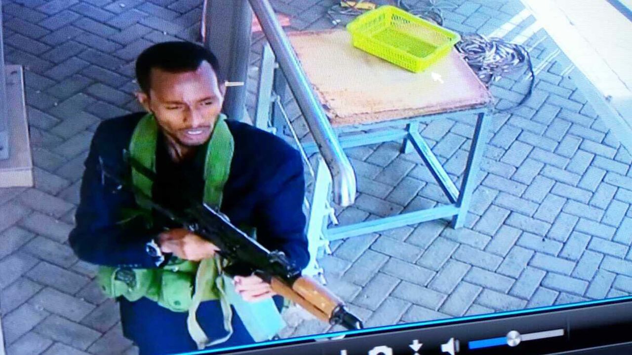 One of the armed attackers is seen on security camera footage in the hotel compound on Tuesday.