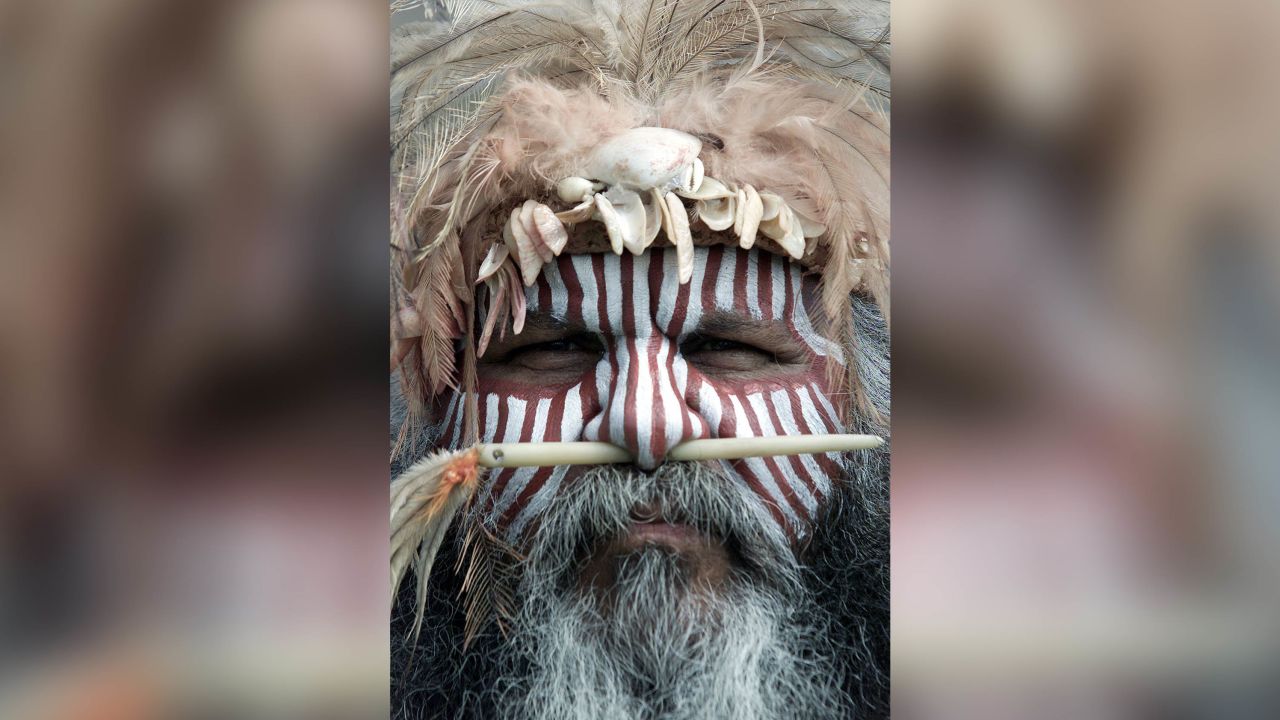 The leader of the "Coorong Mob''" performers with painted face stripes in Alice Springs, Central Australia.