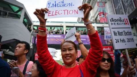 Thai anti-junta activists display placards during a demonstration against the possible delay of the country's general election, in Bangkok on January 8, 2019.