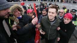 Guardian journalist Owen Jones (C) is confronted by right wing protestors after attending a demonstration in central London on January 12, 2019, against austerity as they call for a UK general election. 