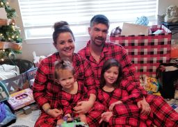 Andrew and Melisa Robinson celebrate Christmas with their two children. 