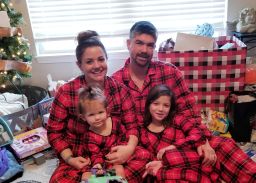 Andrew and Melisa Robinson celebrate Christmas with their two children.