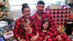 Andrew and Melisa Robinson celebrate Christmas with their two children. 