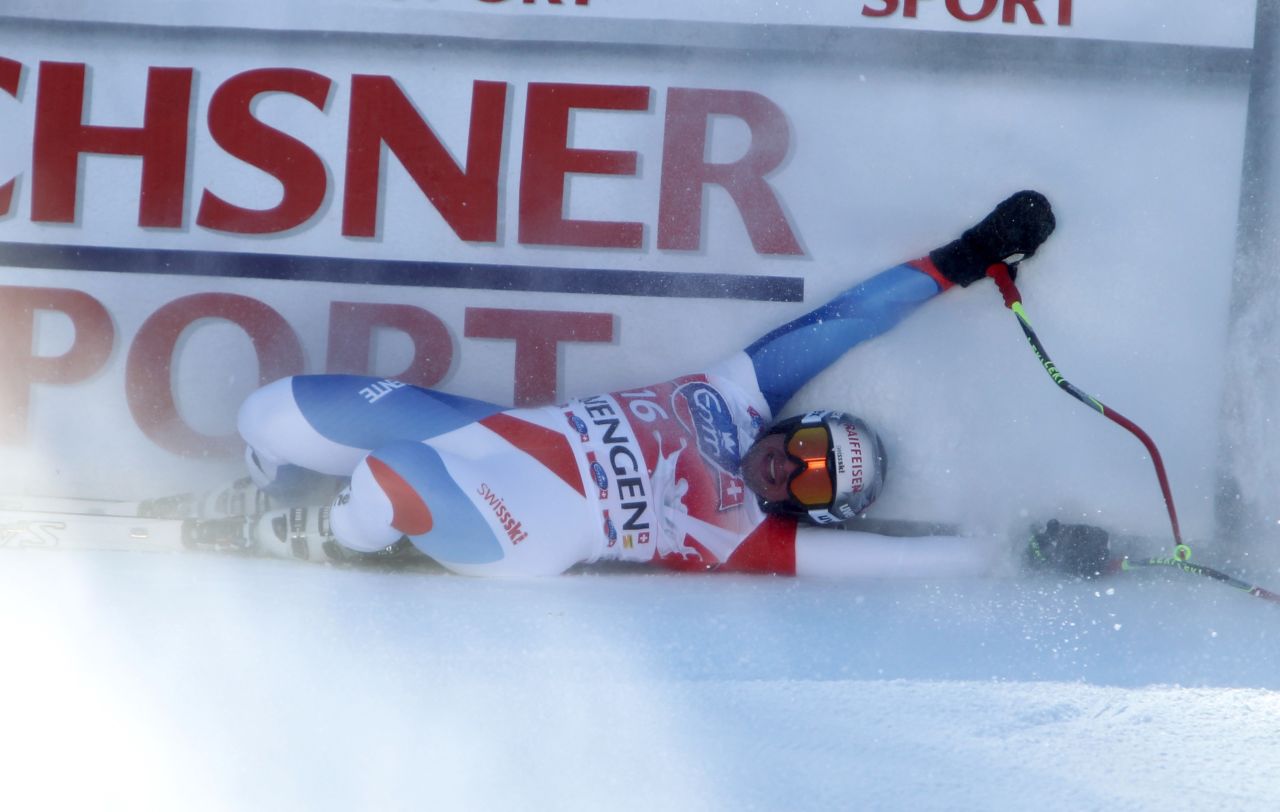 Even two-time champion Beat Feuz of Switzerland feels the physical effects of the legendary Lauberhorn at the finish. 