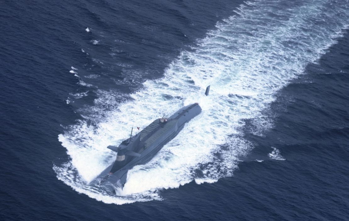 A nuclear-powered submarine of the People's Liberation Army Navy's North Sea Fleet prepares to dive into the sea.