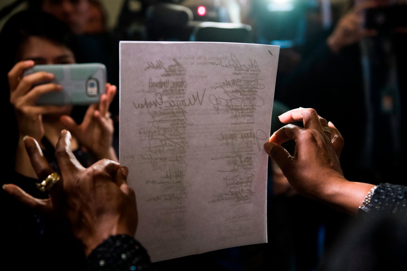 US Rep. Jahana Hayes, D-Connecticut, holds a letter January 16 that was delivered to Senate Majority Leader Mitch McConnell's office, urging the Senate to act on House-passed legislation to reopen the government.