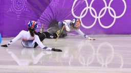 TOPSHOT - South Korea's Shim Suk-hee (L) and South Korea's Choi Minjeong crash during the women's 1,000m short track speed skating A final event during the Pyeongchang 2018 Winter Olympic Games, at the Gangneung Ice Arena in Gangneung on February 22, 2018. (Photo by Mladen ANTONOV / AFP)        (Photo credit should read MLADEN ANTONOV/AFP/Getty Images)