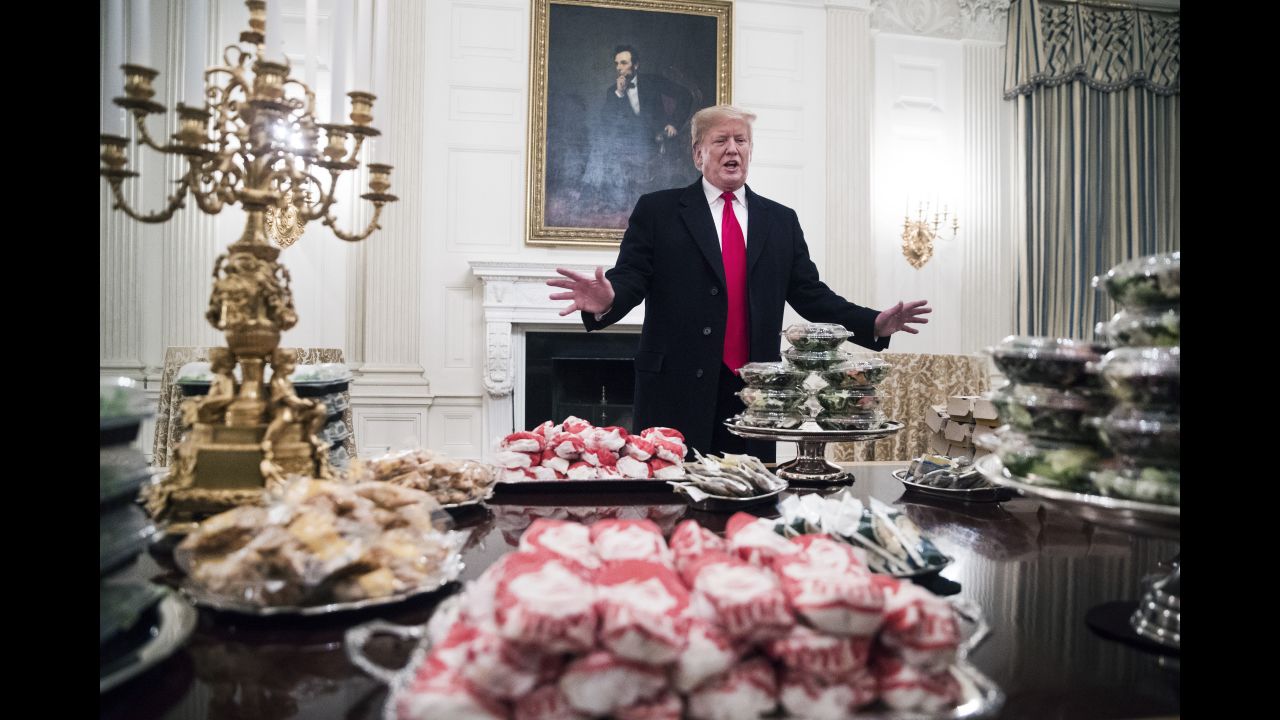 US President Donald Trump speaks alongside <a href="https://www.cnn.com/2019/01/15/politics/donald-trump-fast-food-clemson-tigers/index.html" target="_blank">fast food he purchased</a> for a ceremony honoring the 2018 College Football Playoff National Champion Clemson Tigers on Monday, January 14. Many of the executive residence staff, who are ordinarily responsible for catering such receptions, were <a href="https://www.cnn.com/2019/01/14/politics/donald-trump-clemson-food/index.html" target="_blank">either furloughed or at home</a> because of the federal government snow closure.